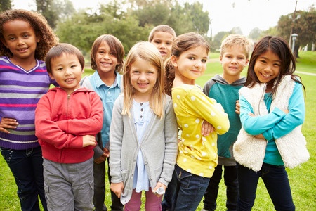 42307619 - group of young children hanging out in park